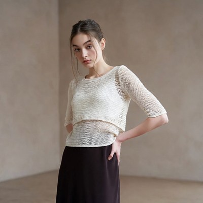 Woman posing in a simple outfit