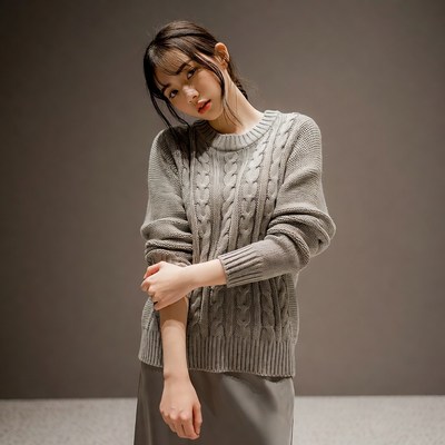 Model in gray sweater posing indoors