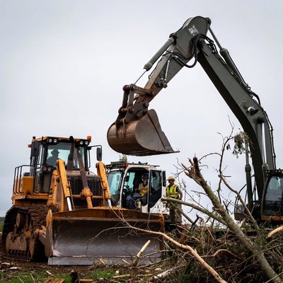 Heavy machinery clears debris after storm