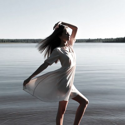 Woman dancing by the water