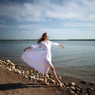Woman walking by the water