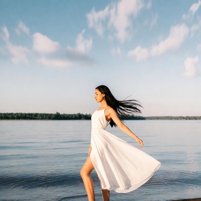 Woman in white dress by water