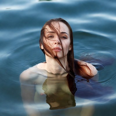 Woman in water with flowing hair