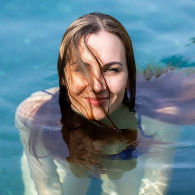 Woman swimming in clear water