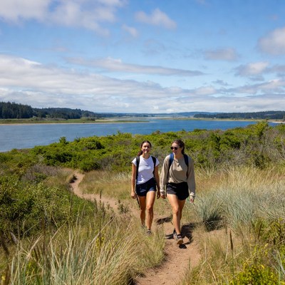 Friends hike along coastal path