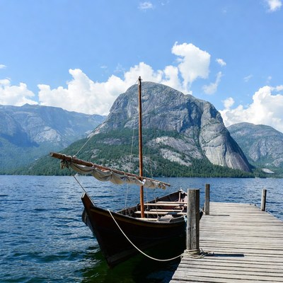 Sailing boat at mountain lake dock