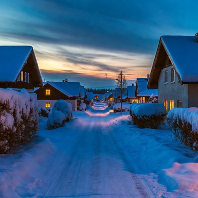 Snowy street at dusk in winter