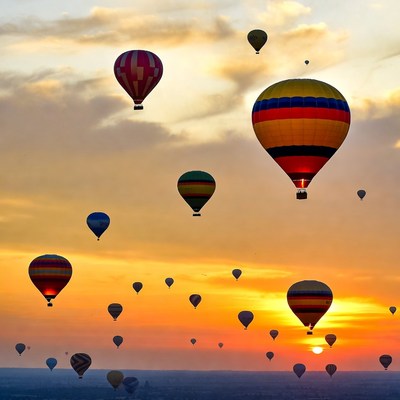 Hot air balloons at sunset in the sky
