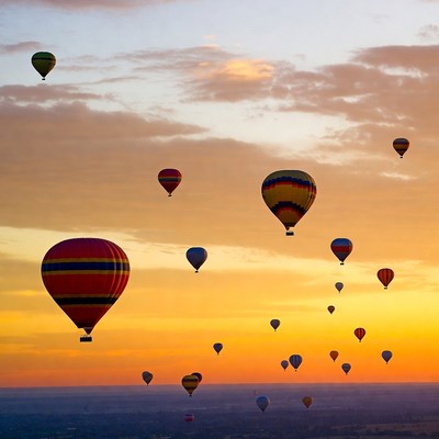 Hot air balloons at sunset in the sky