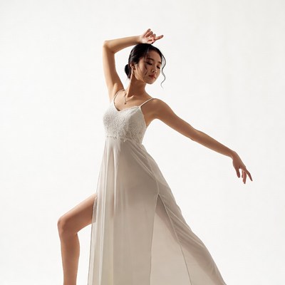 Dance pose in white dress
