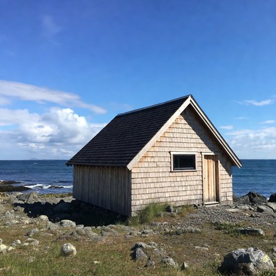 Wooden cabin by the ocean shore