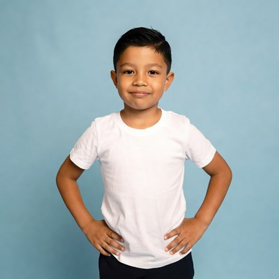 Boy standing with hands on hips