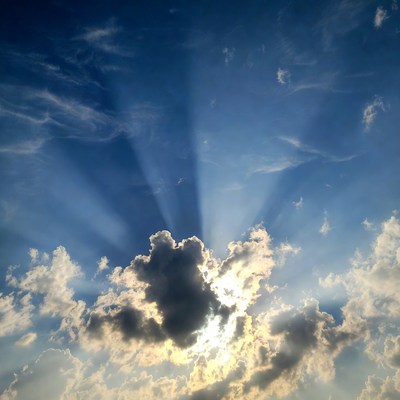 Cloudy sky with sunlight shining through