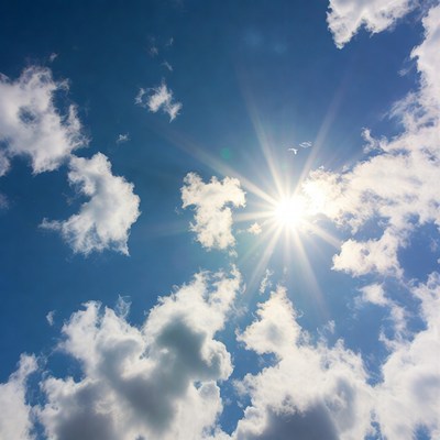 Bright sun shines through clouds