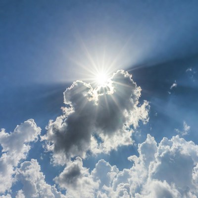 Clouds in bright sky with sun