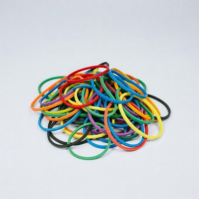 Colorful rubber bands on white background