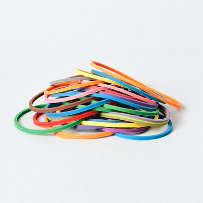 Colorful rubber bands on a white surface