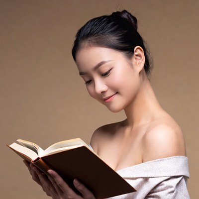 Woman reading a book indoors
