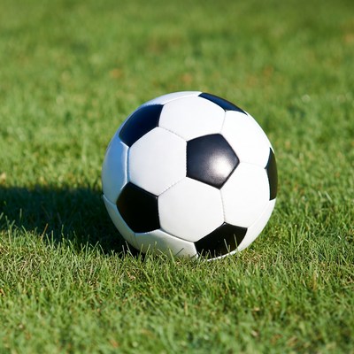 Soccer ball on green grass field