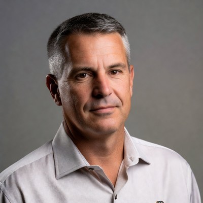 Man in a formal shirt poses for portrait
