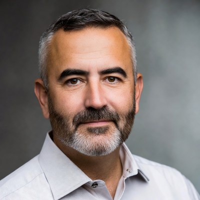 Man with beard and short hair poses