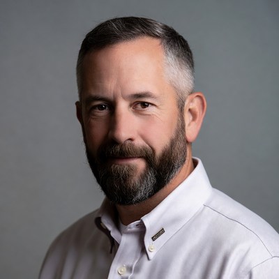 Man with beard poses for a close portrait