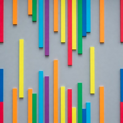Colorful vertical bars on gray wall