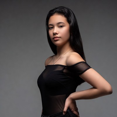 Young woman poses in studio light
