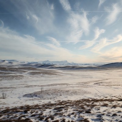 Snowy landscape under blue sky