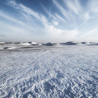 Vast snowy landscape under blue sky