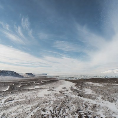 Expansive icy landscape under blue sky