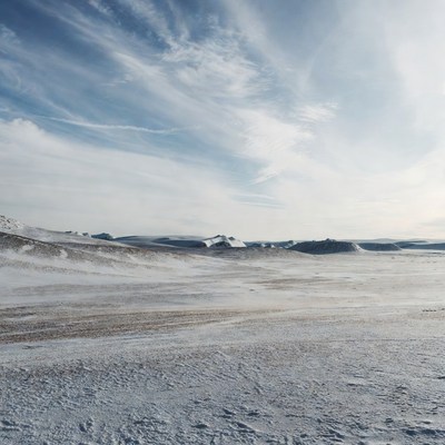Snowy landscape under a cloudy sky
