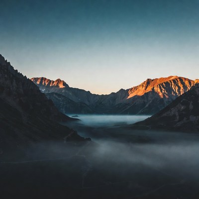 Sunrise over mountain valley mist