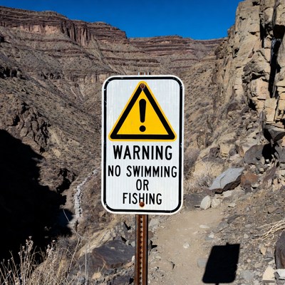Warning sign about swimming and fishing