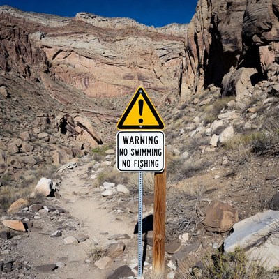 Warning sign in desert landscape