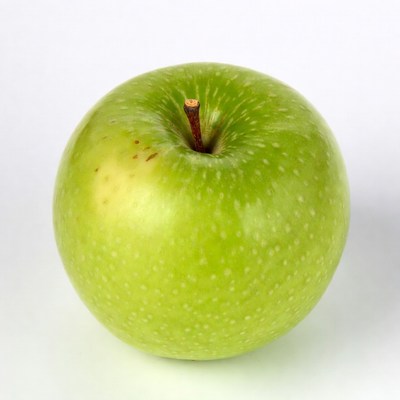 Fresh green apple on plain background