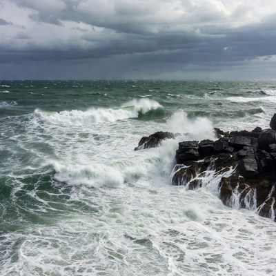Waves crash on rocky shore
