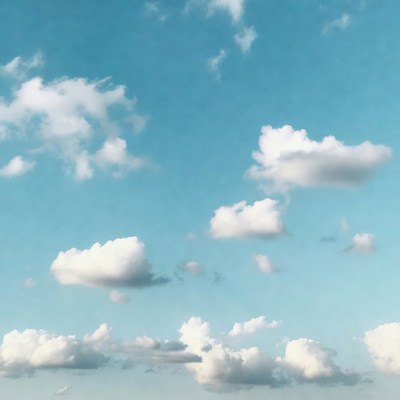 Clouds in a blue sky over open space