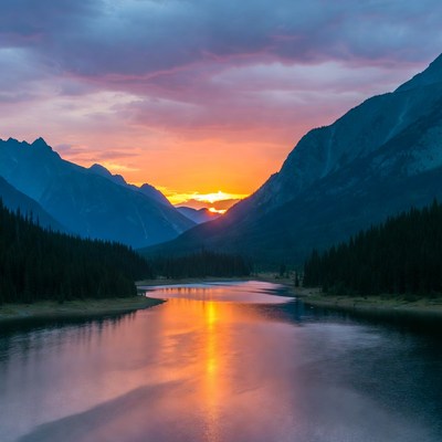 Sunset over mountains and river