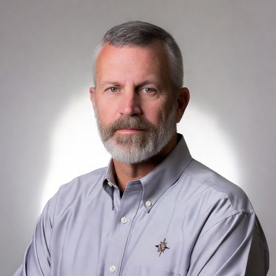 Man with beard in gray shirt
