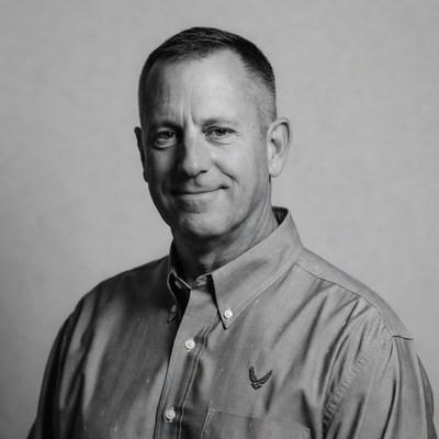 Smiling man in a collared shirt