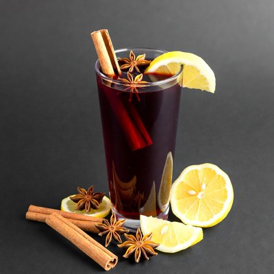 Warm drink with spices and lemon slices