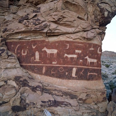 Ancient rock art in desert landscape
