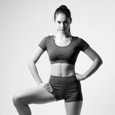 Fitness model striking a pose indoors
