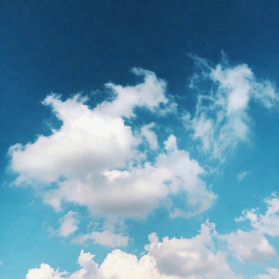 Clouds in a clear blue sky