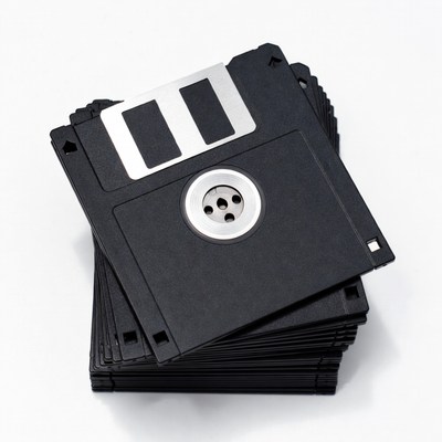 Collection of black floppy disks in a stack