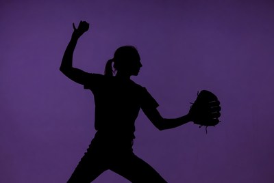 Softball player in action indoors