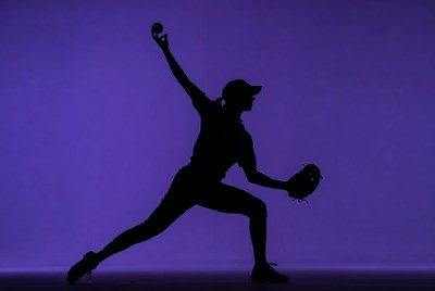 Silhouette of softball player in motion