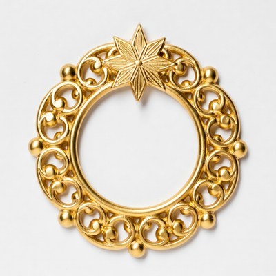 Gold decorative circle with a star design