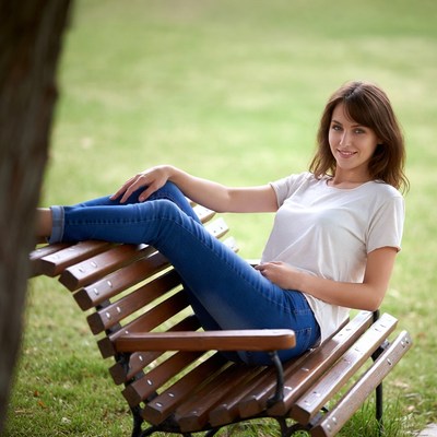 Young woman relaxing on bench